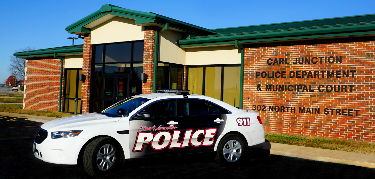 carl junction police cruiser in front of police department building